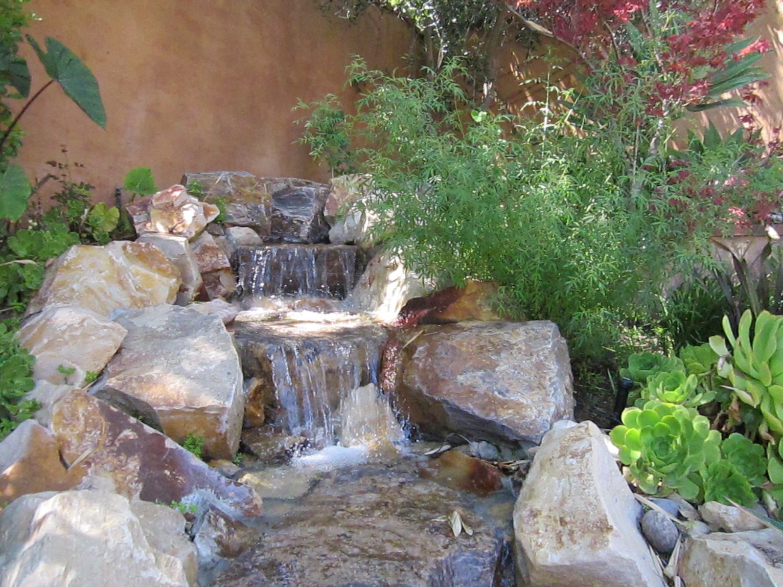 Rustic waterfall garden treatment.